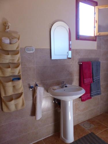 a bathroom with a sink and a mirror at Think Love on Red Sea in Nuweiba