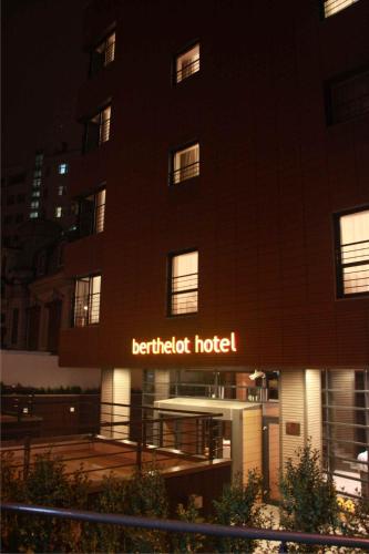 a building with a hotel sign in front of it at Hotel Berthelot in Bucharest