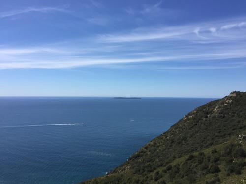 a view of the ocean from a hill at Mini Hotel in Orbetello