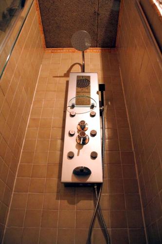 a stove in the middle of a tiled floor at Hosteria Natura in Segovia