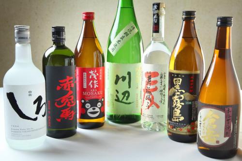 a group of bottles of wine on a table at Chikurakutei in Minami Aso