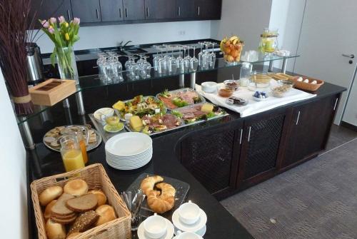 a buffet with a lot of food on a table at Hotel und Cafe Paso in Vierkirchen