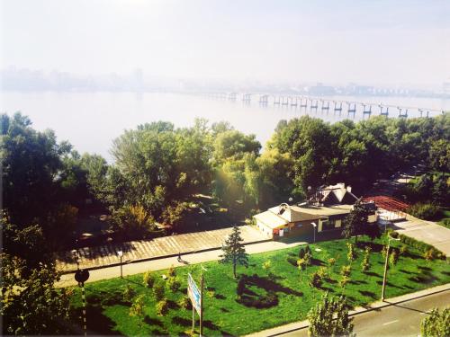 a view of a river with a bridge in the background at Dnipro evening, view # Вечірній Дніпро у центрі, фантастичний вид in Dnipro