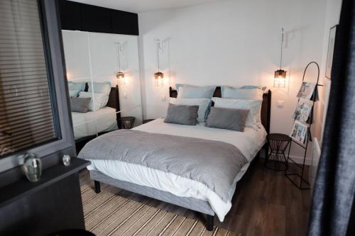 Säng eller sängar i ett rum på L'Orangeraie et la Palmeraie d'Endoume