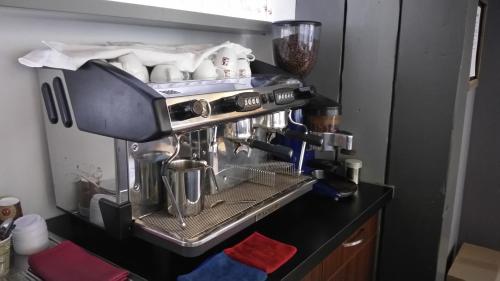 a coffee maker on a counter in a kitchen at Wasserturm Hotel Mannheim in Mannheim