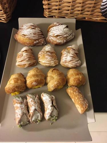 a box of pastries sitting on a table at Hotel Lady Mary in Milano Marittima