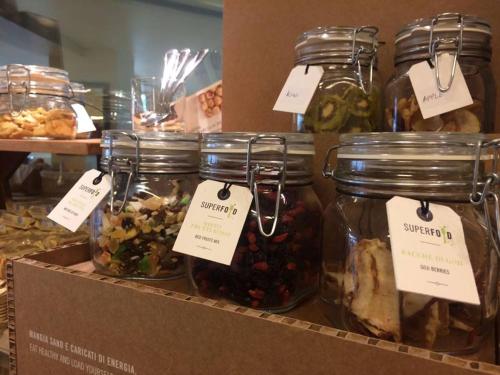 a display of jars of food on a shelf at Hotel Lady Mary in Milano Marittima