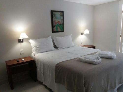 Ein Bett oder Betten in einem Zimmer der Unterkunft Pousada Blue Ocean