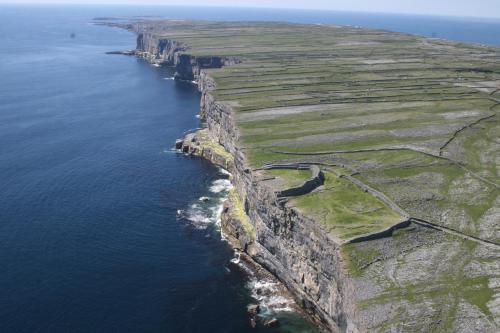 an aerial view of an island in the ocean at Aran Islands Camping & Glamping in Kilronan