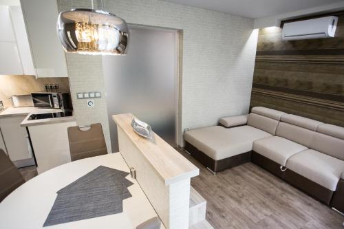 Kuchyňa alebo kuchynka v ubytovaní All Seasons Apartment