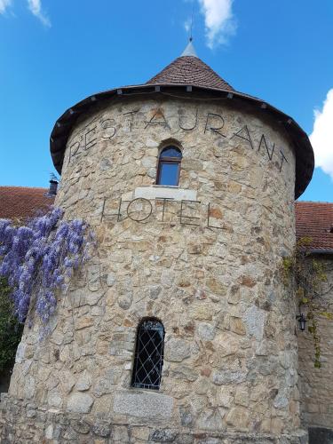 a tower with a window on top of a building at Domaine de Vareilles in Vareilles
