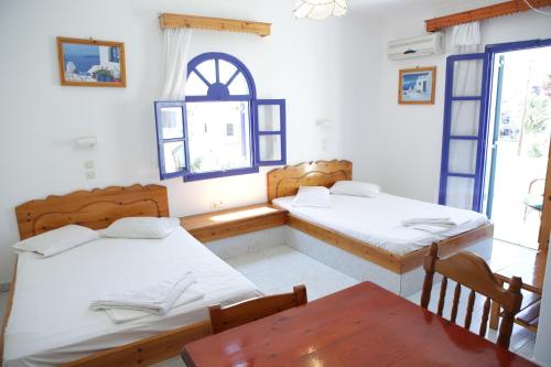 Una cama o camas en una habitación de Hotel Perissa