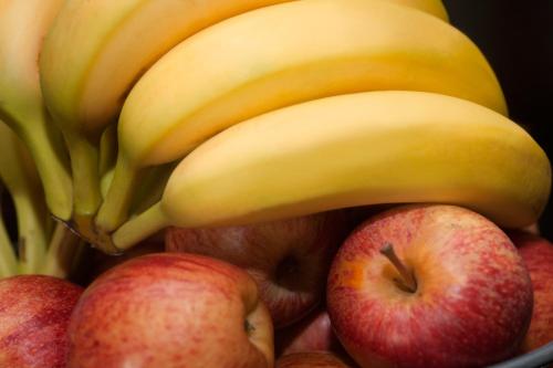 a bunch of bananas and apples in a bowl at Super 8 by Wyndham Sarnia ON in Sarnia