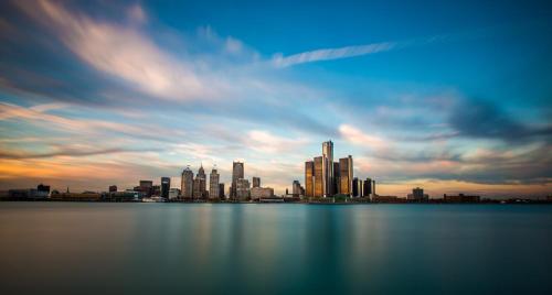 a view of a city skyline from the water at The Inn at 97 Winder in Detroit