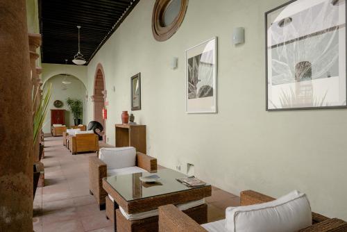 a living room with couches and a table at Hotel La Morada in San Miguel de Allende