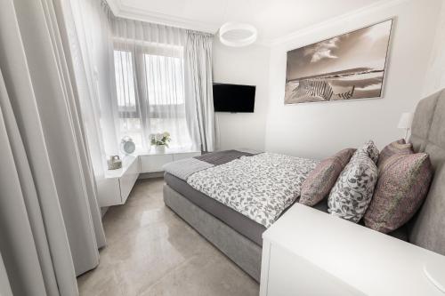 Cama o camas de una habitación en Apartamenty Horyzont Perła