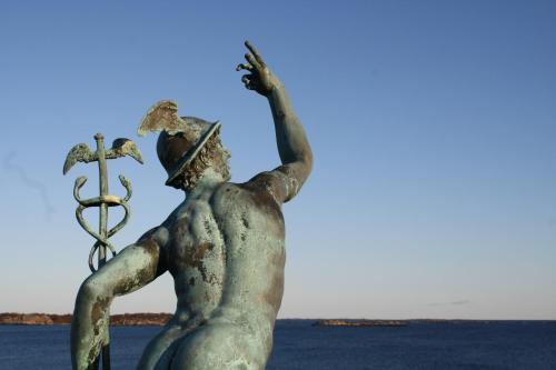 a statue of a woman holding an anchor at Brudhäll Hotel & Restaurant in Kökar