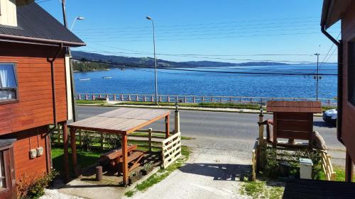 a view of a lake from a house at Hostal Vista al Mar hct in Ancud