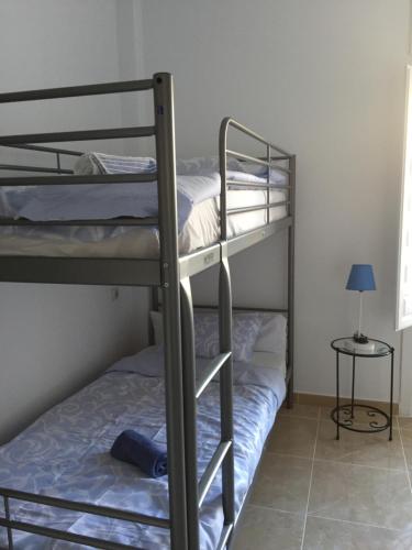 Cama o camas de una habitación en Málaga Centro Hostel