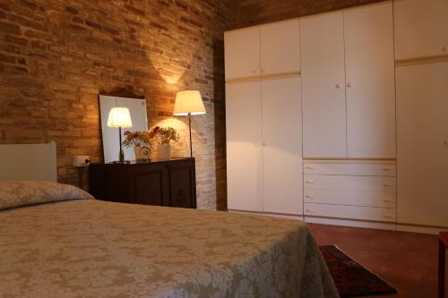 A bed or beds in a room at La Casa Sul Borgo