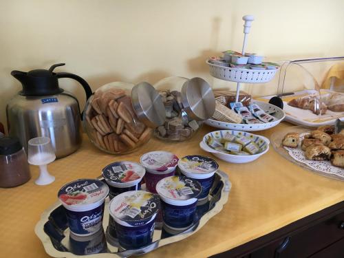 a counter with a bunch of food on a table at La Città degli Dei in Agrigento
