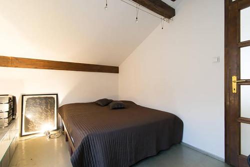 a bedroom with a bed in the corner of a room at Old Town Apartment in Sarajevo