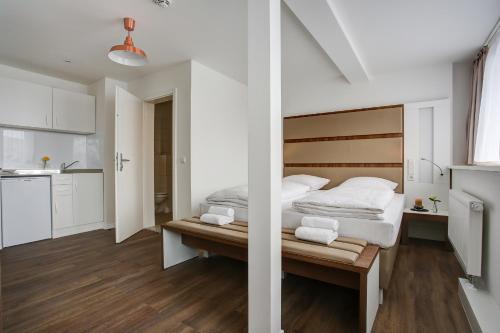 En eller flere senge i et værelse på INA Boutique 030 Hannover-City