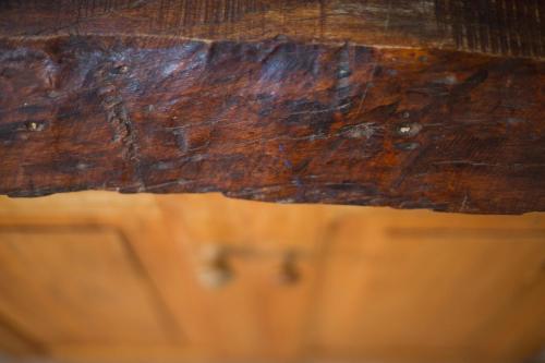 a close up of the wood of a table at Carü Leufu in Valle Grande