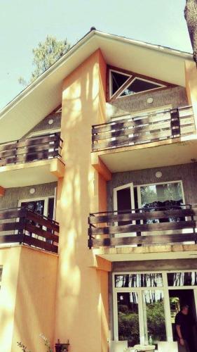 a large house with balconies on the side of it at Villa Vachnadze in Shekvetili