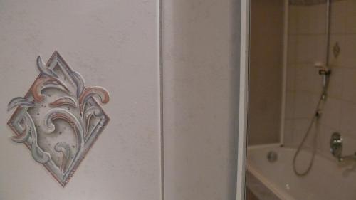 a door with a silver door handle in a bathroom at Apartments Seegartl in Fuschl am See