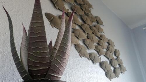 a group of leaves hanging on a wall at Ferienwohnungen Auf der Düne in Cuxhaven