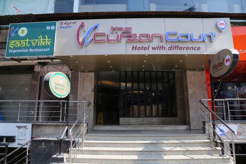a store front of a building with stairs in front at The Curzon Court in Bengaluru