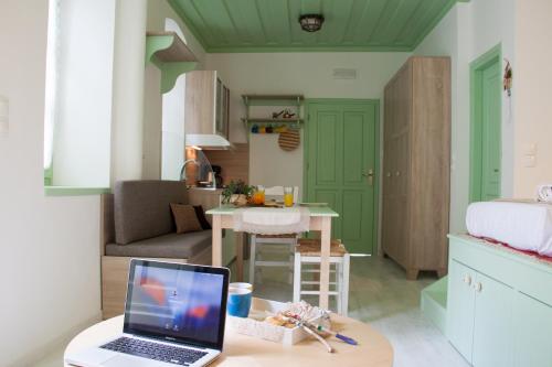 a laptop computer sitting on a table in a room at Villa Klytia in Halki