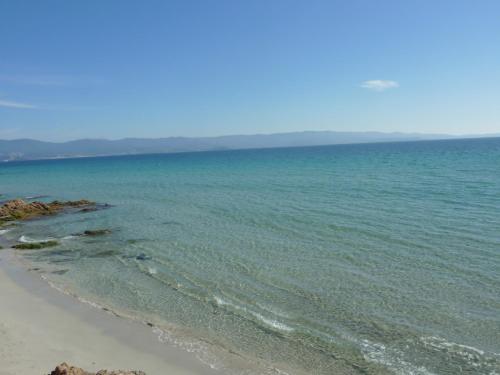 a view of the ocean from the beach at Hôtel La Pinède in Ajaccio