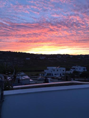 a view of a sunset from a balcony at Peristeronas Village in Klouvas