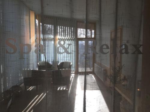 a room with a sign on the wall of a building at Tylebäck Hotell & Konferens, BW Signature Collection in Halmstad
