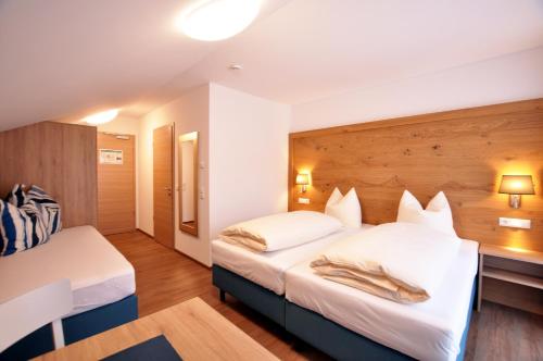 Katil atau katil-katil dalam bilik di Gästehaus zur Krone