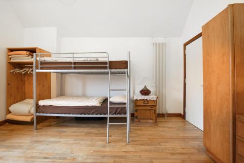 a bedroom with two bunk beds and a mirror at Slemish Barn Hostel in Ballymena