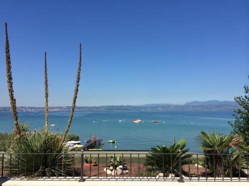 a view of a body of water with boats in it at Hotel La Rondine in Sirmione