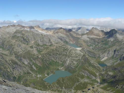 an aerial view of two lakes in a mountain range at Albergo Robiei in San Carlo