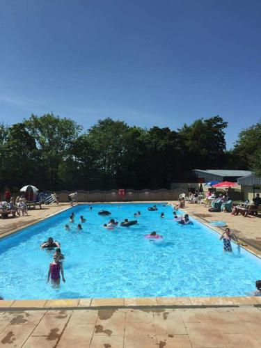 a group of people in a large swimming pool at 147 Snowdon Drive, Glan Gwna in Caernarfon