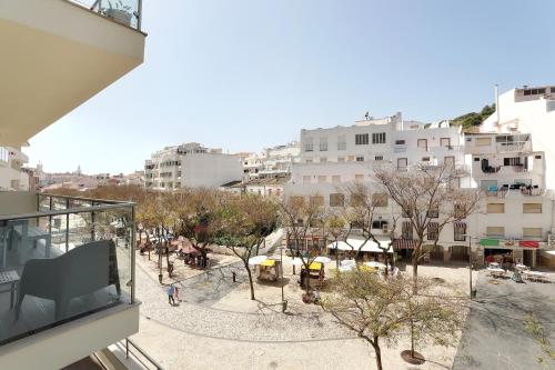 an overhead view of a city with buildings and trees at Original 3 Bedroom Downtown in Albufeira
