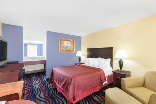Ένα ή περισσότερα κρεβάτια σε δωμάτιο στο Days Inn by Wyndham Uvalde