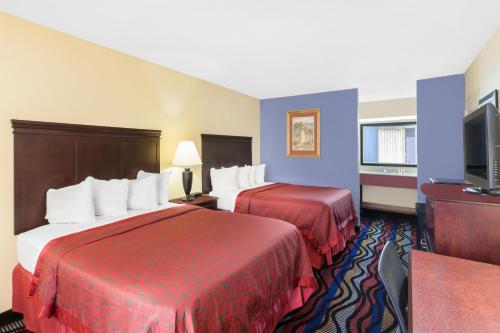 Ένα ή περισσότερα κρεβάτια σε δωμάτιο στο Days Inn by Wyndham Uvalde