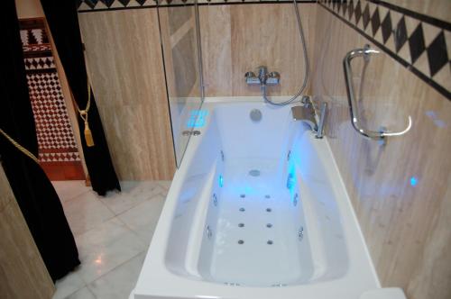 a white tub in a bathroom with a shower at Luxury Apartment Plus Ultra in Seville
