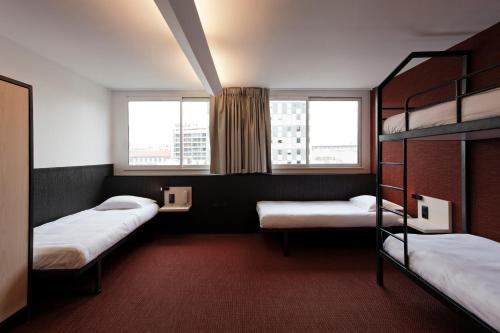 Postel nebo postele na pokoji v ubytování FIAP Paris