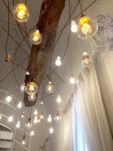 a bunch of lights hanging from a tree at B&B Le Ferule in Manfredonia