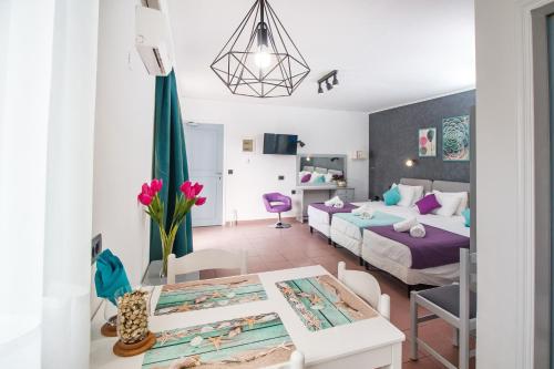 Postel nebo postele na pokoji v ubytování Kahlua Hotel Apartments