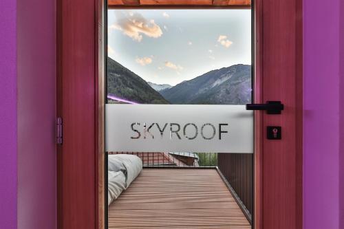 a door to a balcony with a sign that reads snowopt at Belvenu Boutique Hotel in Glorenza