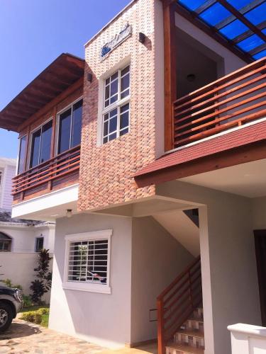 a house with a balcony on top of it at Blue Acuarela in Cabrera
